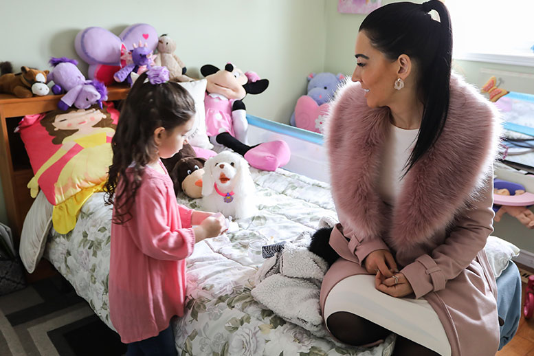 Woman and Young Girl talking in girl's room - Cripps Realty